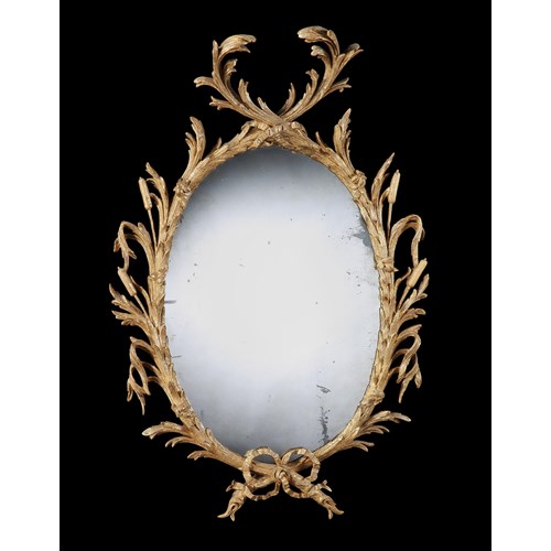 A giltwood oval mirror